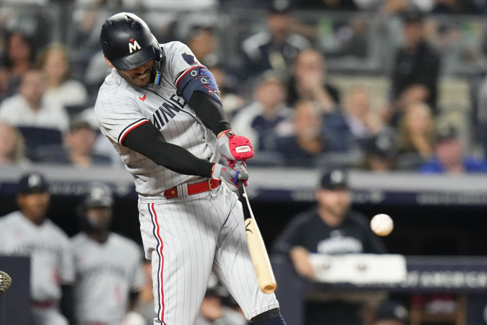 Minnesota Twins' Carlos Correa hits a two-run double against the New York Yankees during the eighth inning of a baseball game Friday, April 14, 2023, in New York. (AP Photo/Frank Franklin II)