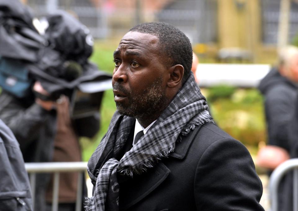 Ex-United striker Andrew Cole attends the service (PA)