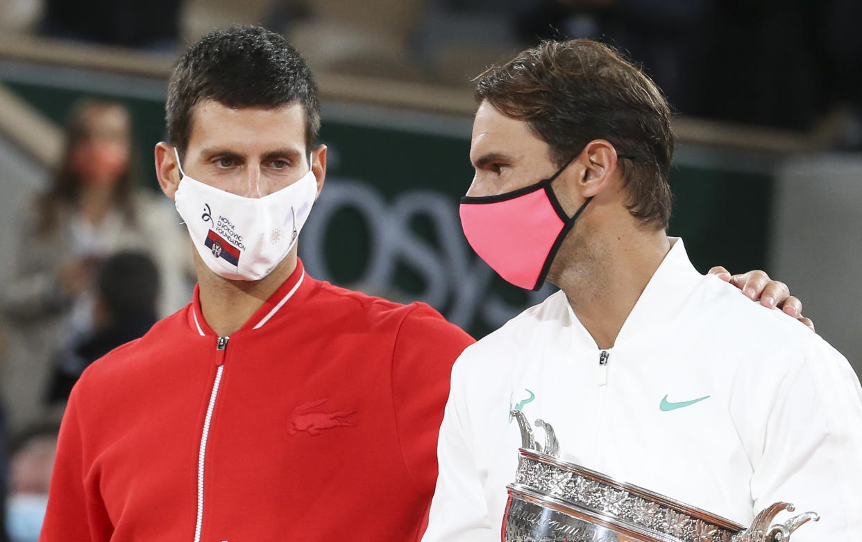 PARIS, FRANCE - OCTOBER 11: Finalist Novak Djokovic of Serbia, winner Rafael Nadal of Spain during the trophy ceremony of the Men's Final on day 15 of the 2020 French Open on Court Philippe Chatrier at Roland Garros stadium on October 11, 2020 in Paris, France. (Photo by John Berry/Getty Images)