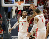 Dayton's Trey Landers (3) and Obi Toppin (1) celebrate during the second half of an NCAA college basketball game against George Washington, Saturday, March 7, 2020, in Dayton, Ohio. (AP Photo/Tony Tribble)