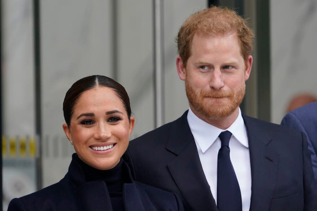 Meghan Markle and Prince Harry pose for pictures after visiting the observatory in One World Trade in New York on Sept. 23, 2021. (AP Photo/Seth Wenig, File)