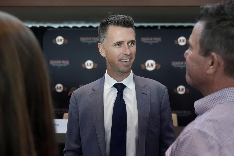 San Francisco Giants president of baseball operations Buster Posey speaks with people after a news conference in San Francisco, Tuesday, Oct. 1, 2024. (AP Photo/Jeff Chiu)