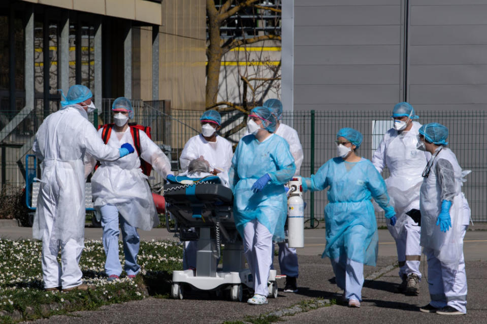 Medical staff transport a patient on a stretcher to a medical helicopter at the Emile Muller Hospital in Mulhouse, eastern France.