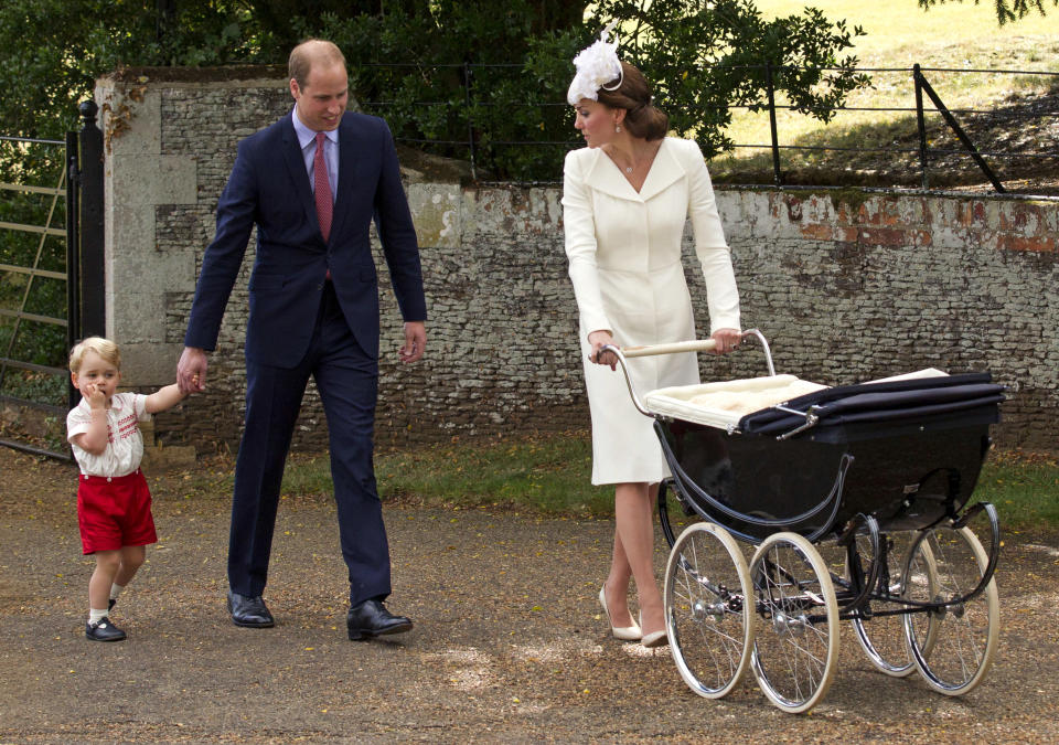 Catherine, Duchess of Cambridge, Prince William, Duke of Cambridge, Princess Charlotte of Cambridge and Prince George of Cambridge leave the Church of St Mary Magdalene on the Sandringham Estate after the Christening of Princess Charlotte of Cambridge on July 5, 2015 