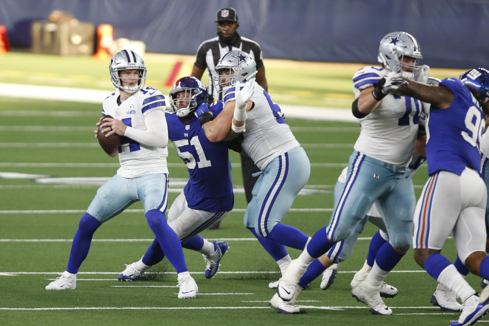 Oct 11, 2020; Arlington, Texas, USA; Dallas Cowboys quarterback Andy Dalton (14) looks to throw from the pocket in the fourth quarter against the New York Giants at AT&T Stadium. Mandatory Credit: Tim Heitman-USA TODAY Sports