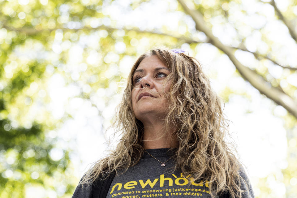 Caroline Hansen poses for a portrait, Thursday, Aug. 11, 2022, in New York. Hansen used to hand-deliver two packages containing fresh food, meats, and vegetables a month to her husband, who is serving life without parole at Sullivan Correctional Facility for murder, but now has to send him packages containing food and other essentials through a third-party vendor. (AP Photo/Julia Nikhinson)