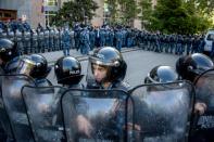Armenian special police forces block the entrance of the government's headquarters during an anti-government rally, in central Yerevan on April 19, 2018.Police in the Armenian capital Yerevan detained scores of demonstrators on April 19, 2018