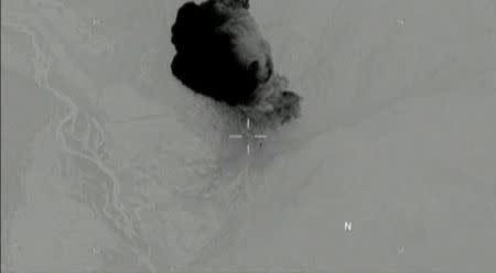 Still image taken from a video released by the U.S. Department of Defense on April 14, 2017 shows the moment the "mother of all bombs" struck the Achin district of the eastern province of Nangarhar, Afghanistan, bordering Pakistan where U.S. officials said a network of tunnels and caves was being used by militants linked to Islamic State. DVIDS/Handout via Reuters TV