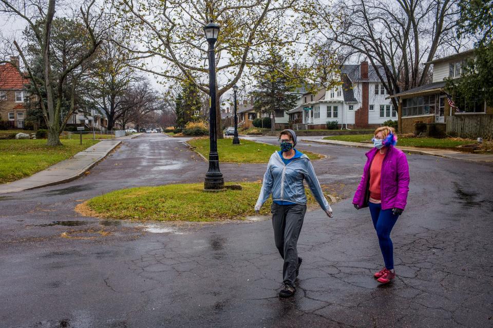 Mary Sue Hosbrough, left, and Jennifer Jacobsen-Wood round a corner Tuesday, Nov. 24, 2020, on West Eleanor Place in Peoria on the one-year anniversary of the start of their quest to walk every street in the city.