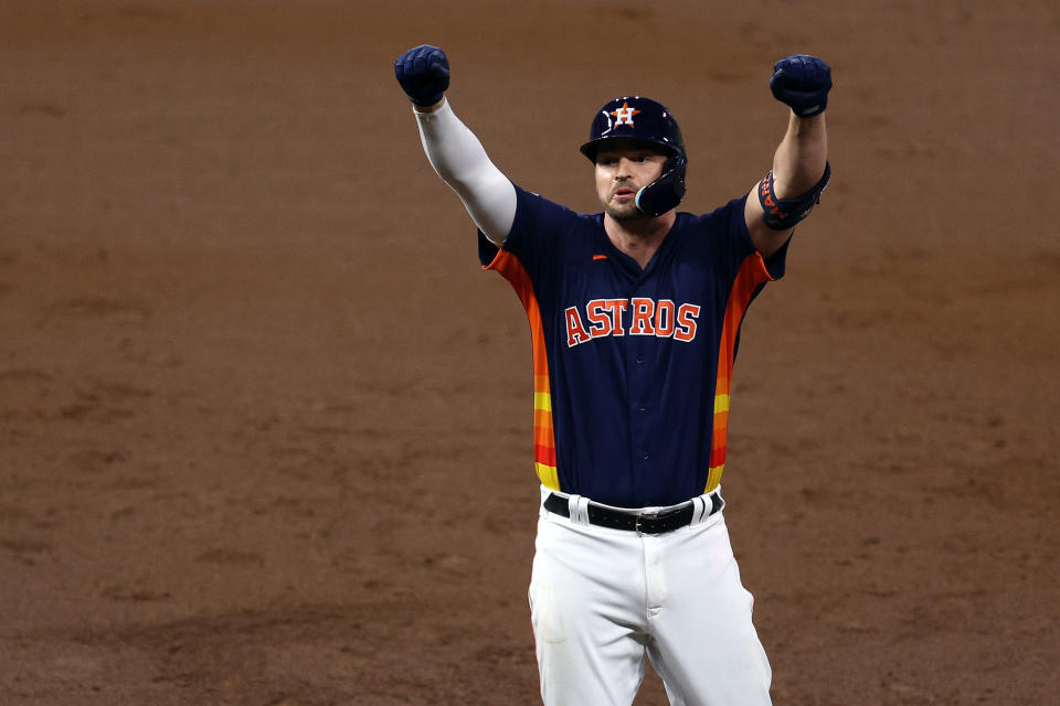 HOUSTON, TEXAS - NOVEMBER 05: Trey Mancini #26 of the Houston Astros reacts after hitting a single against the Philadelphia Phillies during the third inning in Game Six of the 2022 World Series at Minute Maid Park on November 05, 2022 in Houston, Texas. (Photo by Rob Carr/Getty Images)