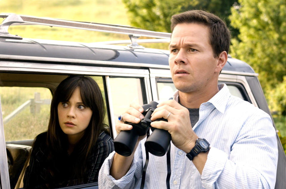 Zooey Deschanel and Mark Wahlberg looking at something