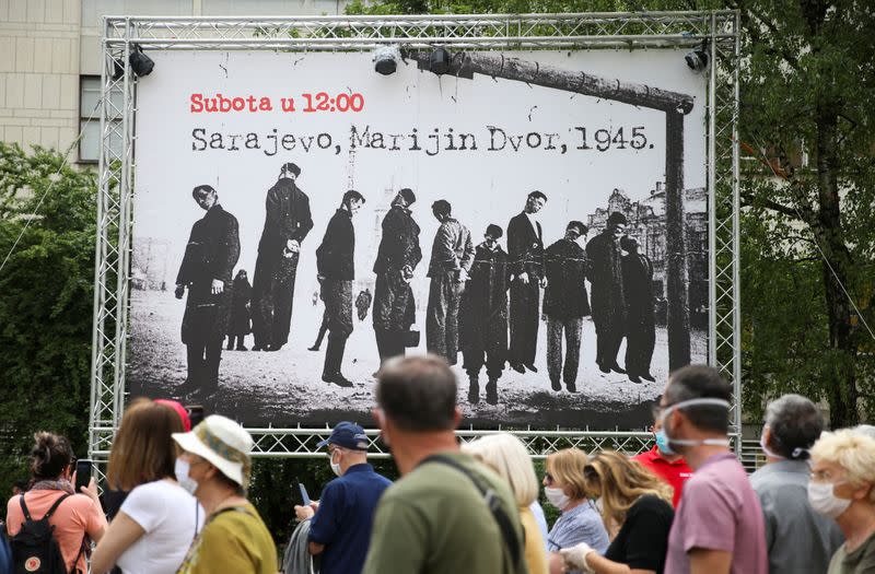 Protesters pay their respects to the victims of World War Two during a protest against a mass for the Nazi collaborators, in Sarajevo