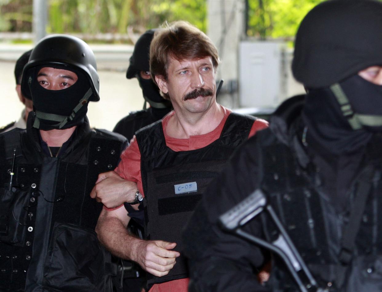 FILE - Viktor Bout, center, is led by armed Thai police commandoes as he arrives at the criminal court in Bangkok, Thailand, Tuesday, Oct. 5, 2010. The Russian arms dealer who once inspired a Hollywood movie is back in the headlines with speculation around a return to Moscow in a prisoner exchange for U.S. WBNA star Brittney Griner and former U.S. Marine Paul Whelan. 