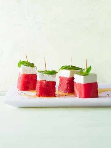 <p>Ripe watermelon is its own special treat, but take it one step further with feta slices and basil leaves. Just remember to make extra because these goodies will go fast.</p><p><em><a href="https://www.goodhousekeeping.com/food-recipes/g1157/watermelon-recipes/?slide=2" rel="nofollow noopener" target="_blank" data-ylk="slk:Get the recipe for Feta-Watermelon Snacks »;elm:context_link;itc:0;sec:content-canvas" class="link ">Get the recipe for Feta-Watermelon Snacks »</a></em> </p>