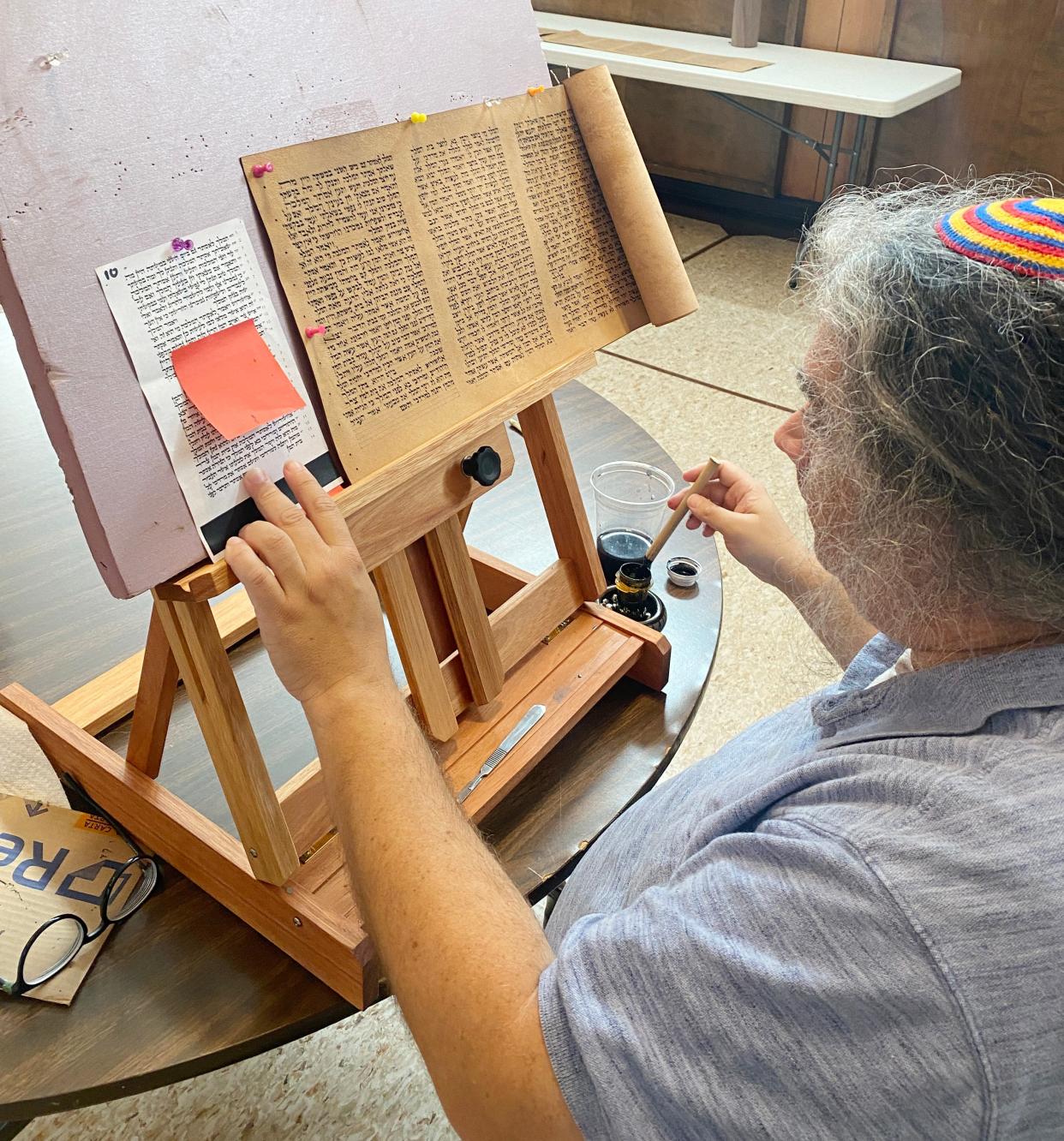 Rabbi Juan Mejia, at Oklahoma City's Emanuel Synagogue, works on a parchment scroll inscribed with The Megillah — the Book of Esther — that was created by Oklahoma-based The Kedusha Project.