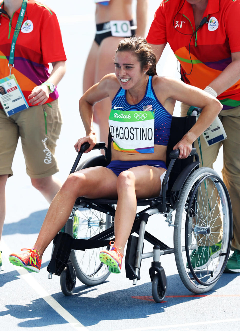 <p>Abbey D’Agostino of the United States is assisted off the track after the Women’s 5000m Round 1 – Heat 2 on Day 11 of the Rio 2016 Olympic Games at the Olympic Stadium on August 16, 2016 in Rio de Janeiro, Brazil. (Photo by Paul Gilham/Getty Images) </p>