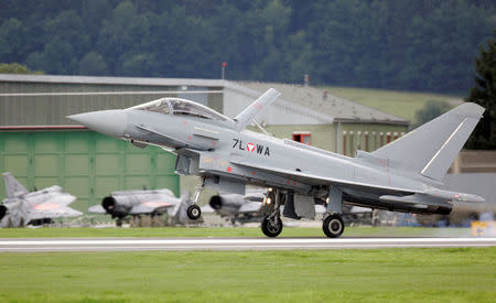 FILE PHOTO: The first Austrian military jet fighter "Eurofighter Typhoon" lands on the military airport in the small Styrian village of Zeltweg, Austria, July 12, 2007. REUTERS/Leonhard Foeger/File Photo