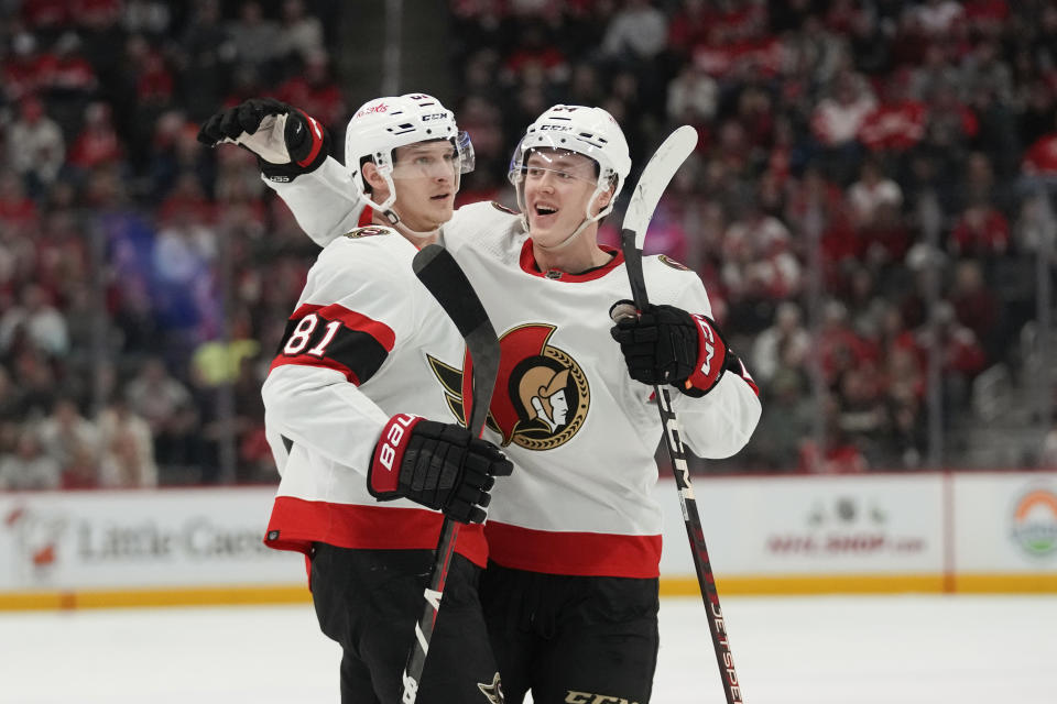 Ottawa Senators left wing Dominik Kubalik (81) celebrates his goal with Jacob Bernard-Docker (24) in the second period of an NHL hockey game against the Detroit Red Wings, Saturday, Dec. 9, 2023, in Detroit. (AP Photo/Paul Sancya)