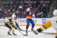 New York Islanders' Robin Salo (2) reaches the for puck with his hand during the second period of an NHL hockey game against Pittsburgh Penguins, Friday, Nov. 26, 2021, in Elmont, N.Y. (AP Photo/Eduardo Munoz Alvarez)