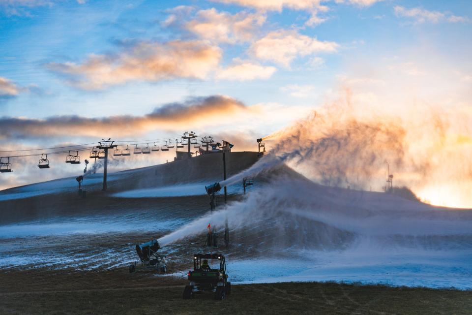 Snow machines at Mount Brighton produce man-made snow to cover the ski slopes on Dec.. 26, 2023.