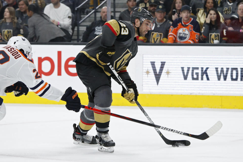 Vegas Golden Knights defenseman Alec Martinez (23) shoots against the Edmonton Oilers during the second period of an NHL hockey game Wednesday, Feb. 26, 2020, in Las Vegas. (AP Photo/John Locher)