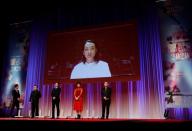 Cast members from the movie 'Underdog' attend the opening ceremony at 33rd Tokyo International Film Festival, amid the coronavirus disease (COVID-19) outbreak, in Tokyo