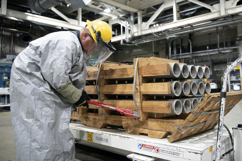 In this image released by the U.S. Army, an operator cuts the metal bands on a pallet of M55 rockets containing GB (sarin) nerve agent on July 6, 2022, at the Blue Grass Army Depot near Richmond, Ky. The United States has destroyed the last of its declared chemical weapons stockpile, a milestone in the history of warfare dating back to World War I. Senate Republican leader Mitch McConnell on Friday, July 7, 2023, said workers at the Blue Grass Army Depot in Kentucky eliminated the last of thousands of rockets filled with sarin nerve gas that have been stored there since the 1940s. (U.S. Army via AP)