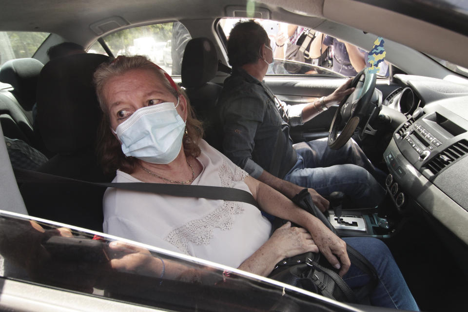 Rosibel Emerita Arriaza, the mother of Victoria Esperanza Salazar who died in police custody in Mexico, leaves the Foreign Ministry after talking to the press in Antiguo Cuzcatlan, El Salvador, Monday, March 29, 2021. Mexican authorities said Monday that an autopsy of Arriaza's daughter confirmed that police broke her neck in the Caribbean resort of Tulum, Mexico. (AP Photo/Salvador Melendez)