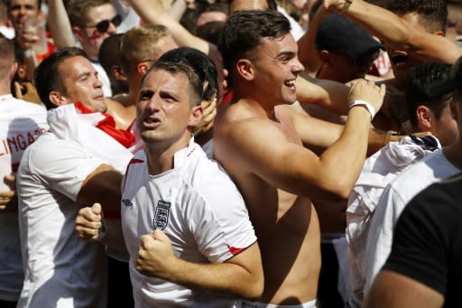 England fans celebrate in London as defender Harry Maguire scores the opening goal against Sweden in the World Cup quarter-final against Sweden
