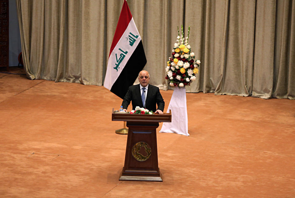 Iraq Prime Minister Haider al-Abadi addresses a newly elected parliament during its first session in Baghdad, Iraq, Monday, Sept. 3, 2018. Iraq's newly elected parliament held its first session as two blocs, both claiming to hold the most seats, vied for the right to form a new government. (AP Photo/Karim Kadim)