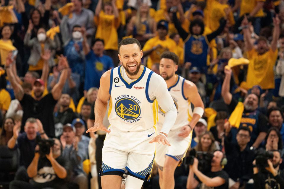 Warriors guard Stephen Curry celebrates during the first quarter of Game 5 against the Lakers.