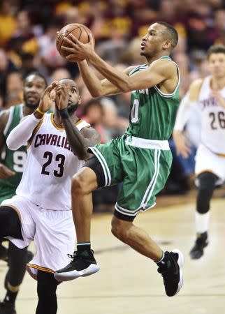 May 21, 2017; Cleveland, OH, USA; Boston Celtics guard Avery Bradley (0) drives to the basket against Cleveland Cavaliers forward LeBron James (23) during the second half in game three of the Eastern conference finals of the NBA Playoffs at Quicken Loans Arena. Mandatory Credit: Ken Blaze-USA TODAY Sports