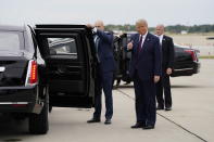 President Donald Trump gives a thumbs up as he arrives at Cleveland Hopkins International Airport for the first presidential debate, Tuesday, Sept. 29, 2020, in Cleveland. (AP Photo/Evan Vucci)