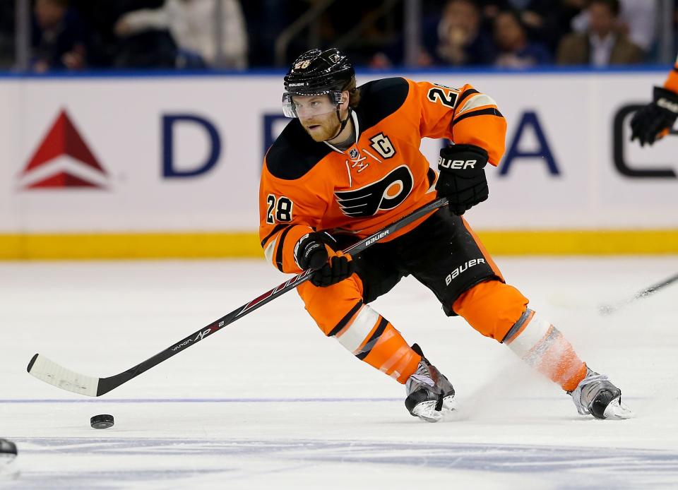 NEW YORK, NY - NOVEMBER 19: Claude Giroux #28 of the Philadelphia Flyers takes the puck in the third period against the New York Rangers on November 19, 2014 at Madison Square Garden in New York City.The New York Rangers defeated the Philadelphia Flyers 2-0. (Photo by Elsa/Getty Images)