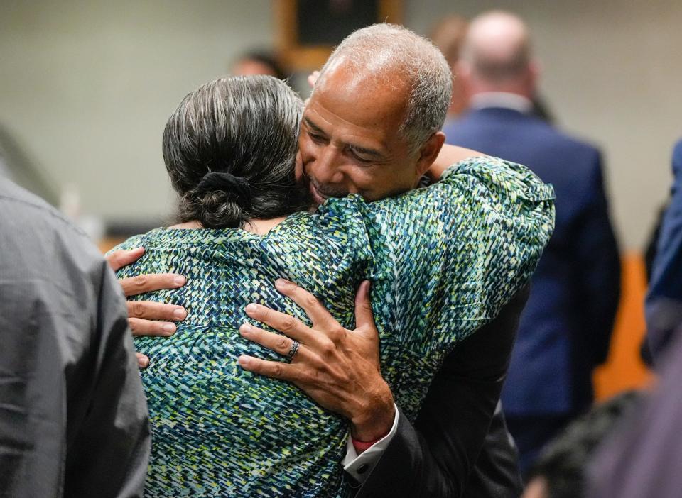 Prosecutor Gary Cobb hugs Brenda Ramos, the victim's mother, in the courtroom.