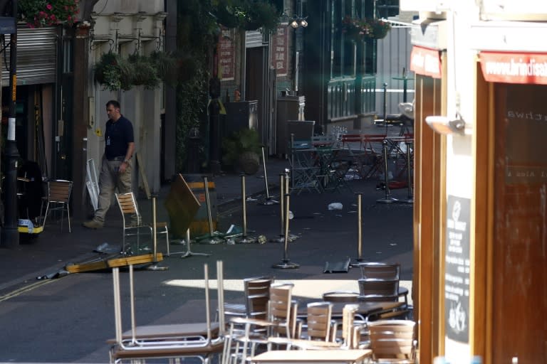 Up-turned tables and debris outside the restaurants, cafes and pubs on Stoney Street at Borough Market in London, one of the scenes of the June 3 terror attack