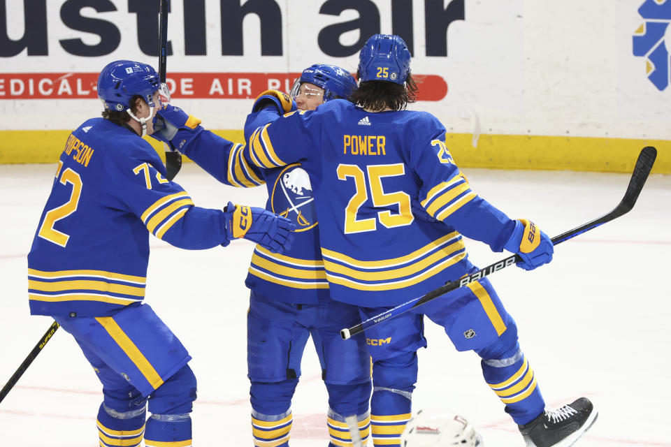 Buffalo Sabres Jeff Skinner (53) center, celebrates after his winning goal with Tage Thompson (72) and Owen Power (25) during the overtime period of an NHL hockey game against the Columbus Blue Jackets, Saturday, Dec. 30, 2023, in Buffalo, N.Y. (AP Photo/Jeffrey T. Barnes)