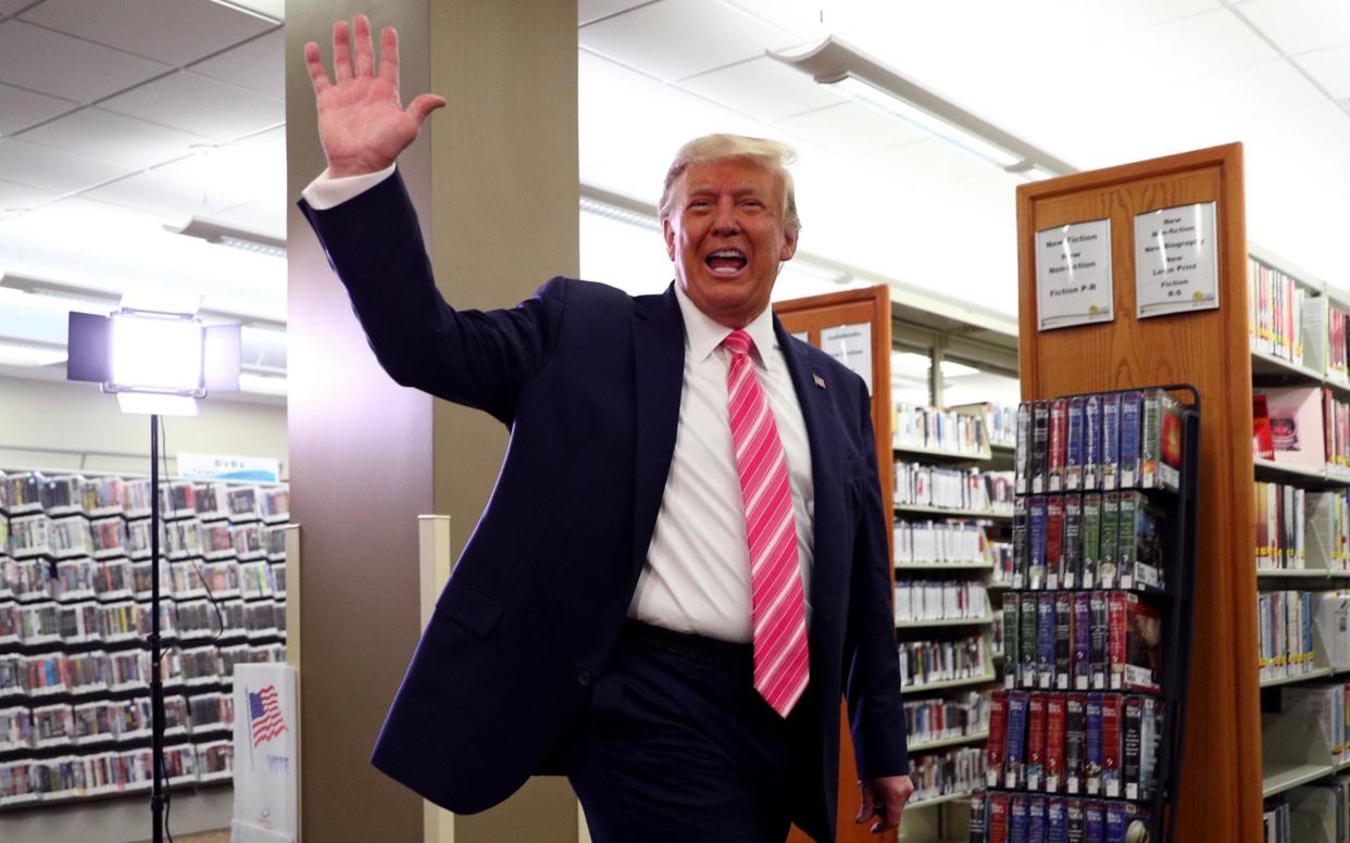 US President Donald Trump leaves after casting his ballot at the Palm Beach County Public Library - REUTERS