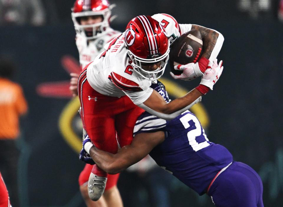 Utah Utes running back Micah Bernard (2) is tackled by Northwestern Wildcats defensive back Rod Heard II (24) as Utah and Northwestern play in the SRS Distribution Las Vegas Bowl at Allegiant Stadium on Saturday, Dec. 23, 2023. Northwestern won 14-7. | Scott G Winterton, Deseret News