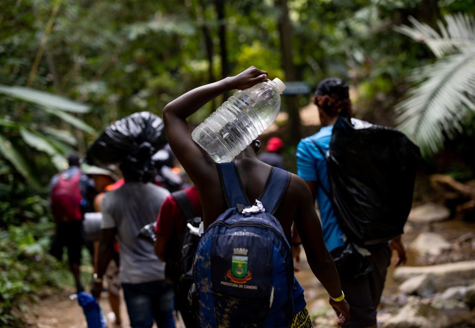 Migrants from Haiti hike on the first day of their journey through the Darién Gap. | Spenser Heaps, Deseret News
