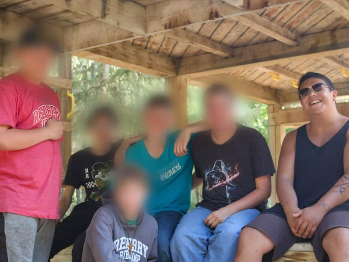 Several parents of children who attended Redberry Bible Camp say Carlos Doerksen, right, the counsellor for a cabin of boys, performed an exorcism on a child who was apparently in medical distress. (Redberry Bible Camp website - image credit)