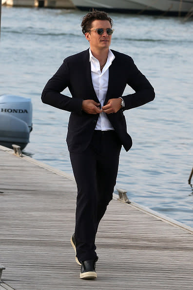 Orlando Bloom on a dock before entering the Leonardo DiCaprio Foundation Gala.