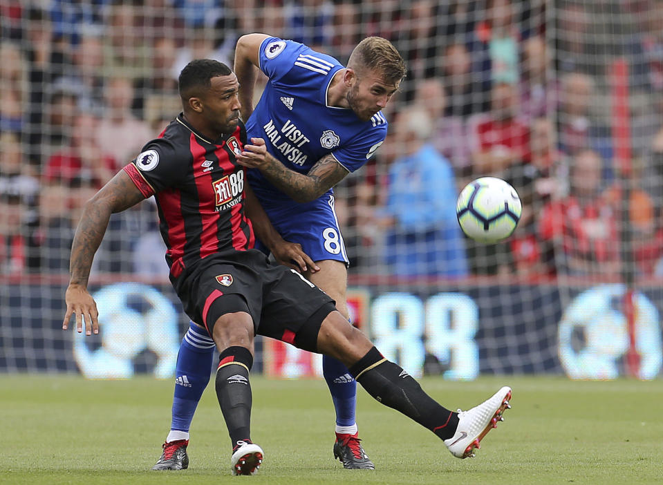 Bournemouth's Callum Wilson, left, and Cardiff City's Joe Ralls during their English Premier League soccer match at the Vitality Stadium in Bournemouth, England, Saturday Aug. 11, 2018. (Mark Kerton/PA via AP)