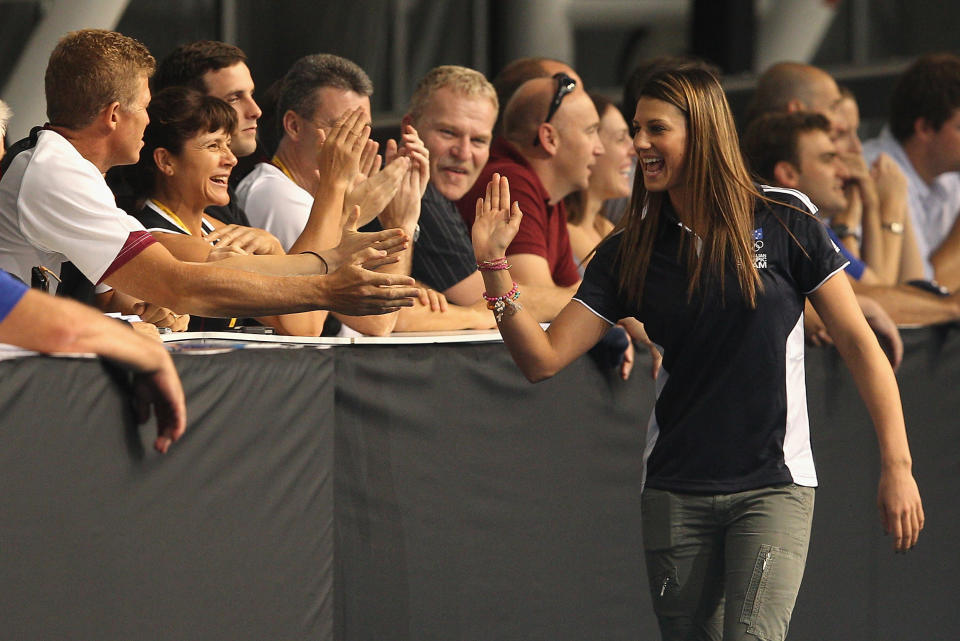 Stephanie Rice of Australia high fives the crowd during the official 2012 Australian Olympic Games Swimming Team Announcement at the South Australian Aquatic & Leisure Centre on March 22, 2012 in Adelaide, Australia. (Photo by Quinn Rooney/Getty Images)