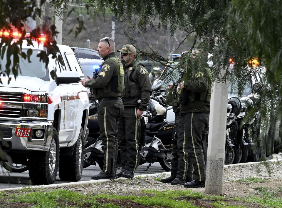 Riverside County Sheriff's stand at the corner of Golden West Ave. and Condor Drive in Jurupa Valley, Calif. Thursday, Dec. 29, 2022. Authorities say a Southern California sheriff’s deputy has been shot during a traffic stop. (Will Lester/The Orange County Register via AP)