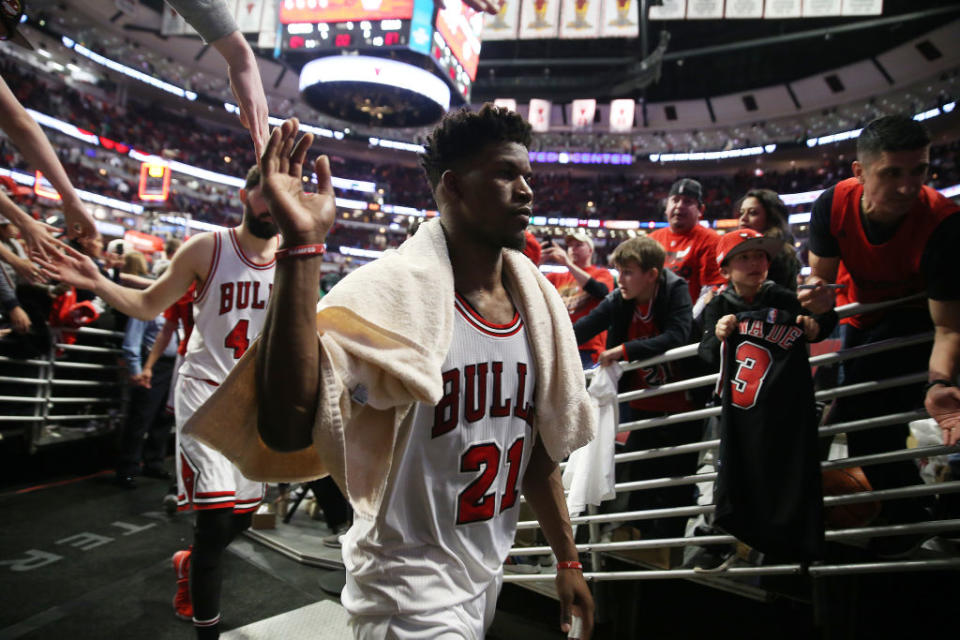 Jimmy Butler high-fives fans as he leaves the court at United Center. (Terrence Antonio James/Chicago Tribune/TNS/Getty Images)