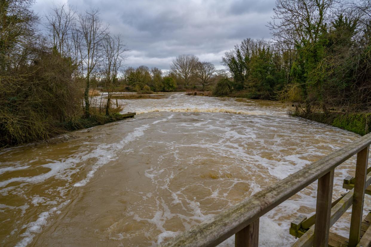 Flood water at Beeleigh Lock at the confluence of the river Chelmar and Blackwater near Maldon Essex