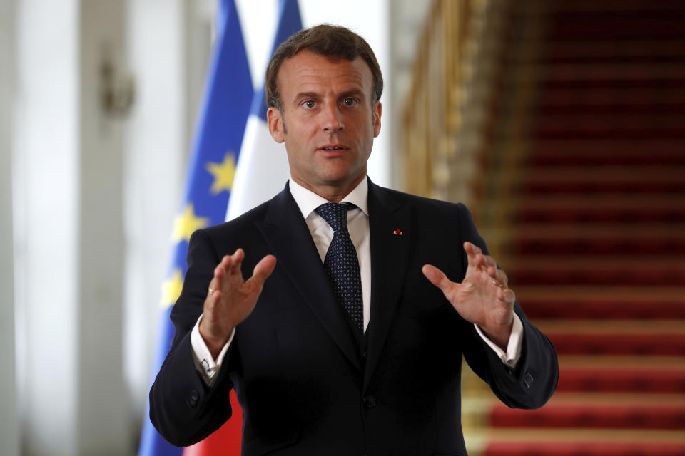 French President Emmanuel Macron speaks after a video-conference summit on vaccination at the Elysee Palace in Paris, Monday, May 4, 2020. World leaders began pledging Monday hundreds of millions of dollars to fund research into a vaccine against the new coronavirus, but warned that it is just the start of an effort that must be sustained over time to beat the disease. (Gonzalo Fuentes/Pool via AP)