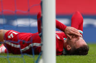 Liverpool's Jordan Henderson reacts after being hit in the face with the ball during the Premier League match at Goodison Park, Liverpool. (Photo by Peter Byrne/PA Images via Getty Images)