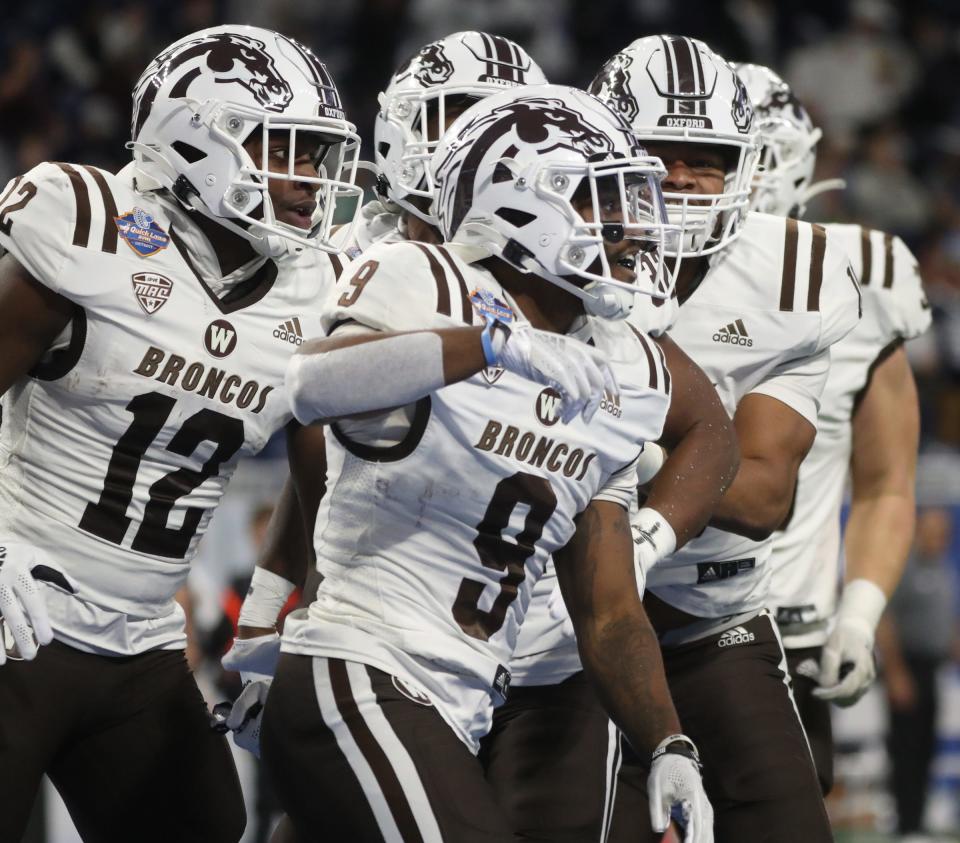 Western Michigan running back Sean Tyler (9) celebrates with teammates after running a kickoff back for a touchdown against Nevada during the first half of the Quick Lane Bowl on Monday, Dec. 27, 2021, at Ford Field.